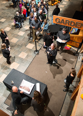 Overhead view of Jim Brandenburg at signing table